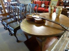 A Mahogany oval extending table with extra leaf and six matching chairs on claw and ball feet -