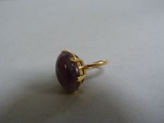 A 9ct ring with amethyst coloured stone