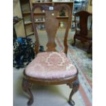 A Queen Anne style upholstered chair