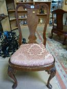 A Queen Anne style upholstered chair