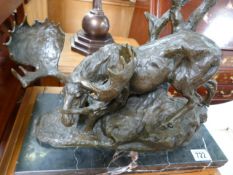 A bronze of a moose on marble plinth