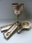 A continental silver ( 800) strainer, a silver plated goblet and a hallmarked silver spoon