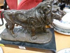 A Bronze Lion on a plinth