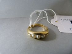 A 9ct gold ring with 5 seed pearls - total weight 5.7g