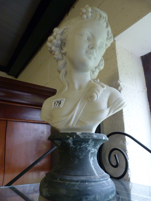 A large bust of a girl in the classical style