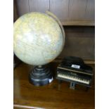 A radio in the form of a grand piano and a globe