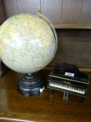 A radio in the form of a grand piano and a globe