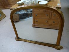 A large over mantle mirror