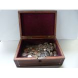 An inlaid jewellery box with various coins
