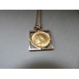 A full sovereign 1912 in a 9ct mount with 9ct gold chain - total weight 18.2g