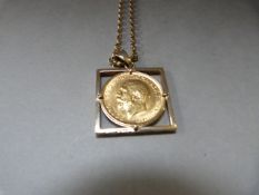 A full sovereign 1912 in a 9ct mount with 9ct gold chain - total weight 18.2g