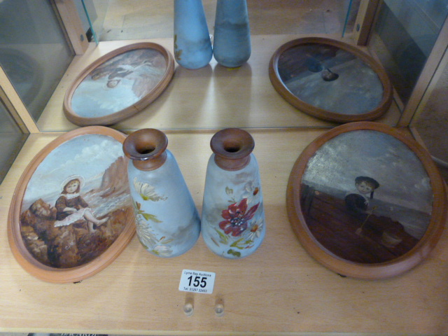 A pair of oil painted Terracotta plaques marked C.M - Torquay ware and two matching vases