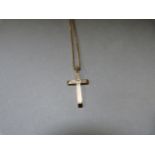 A 9ct gold cross on 9ct chain - weight 5.6