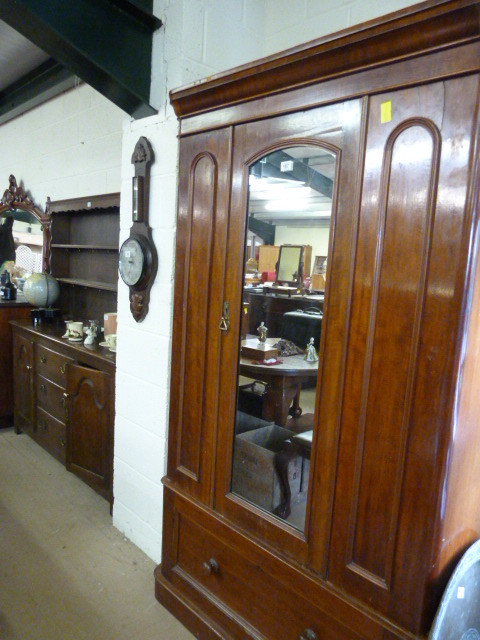 A victorian Mahogany wardrobe with mirrored door