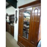 A victorian Mahogany wardrobe with mirrored door