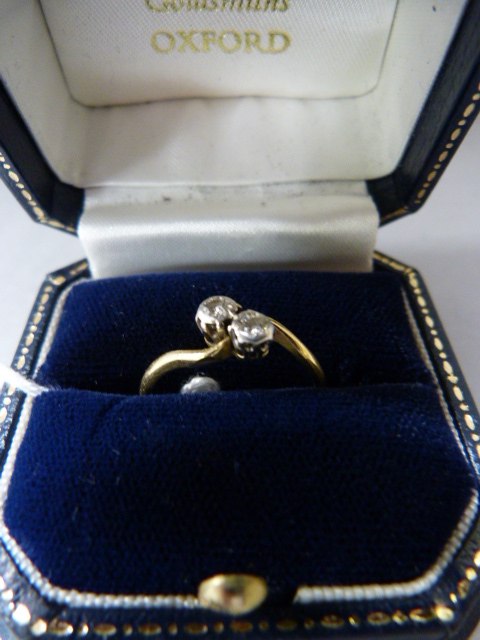 An 18ct and platinum diamond two stone ring