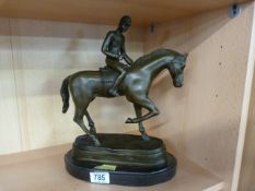 A bronze model of a horse and rider