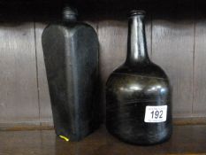 An early mallet shaped bottle and one other