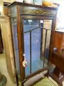 An Edwardian inlaid display cabinet