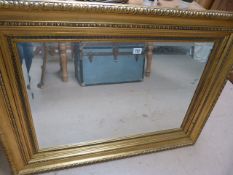 A large gilt framed mirror