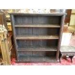 A carved oak bookcase