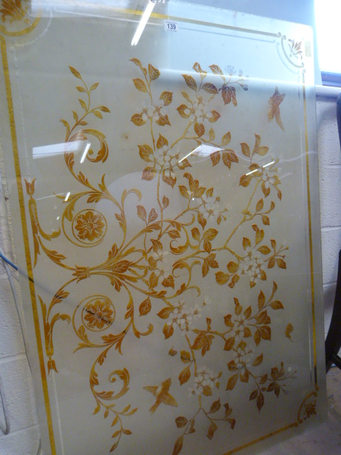 A foliate decorated glass panel