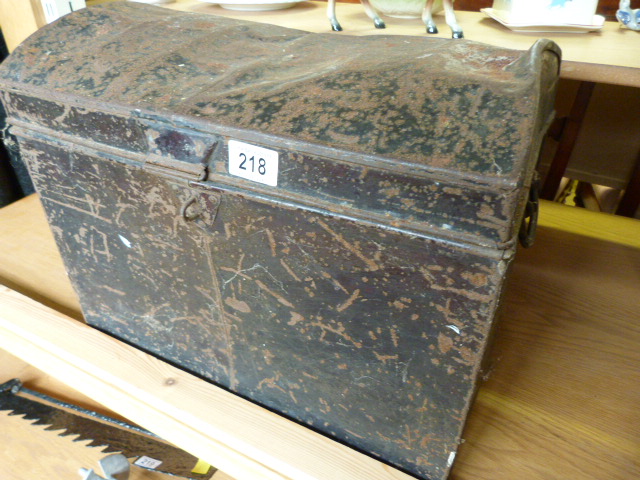 A Black tin trunk containting various boxed vintage games