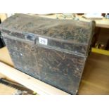 A Black tin trunk containting various boxed vintage games