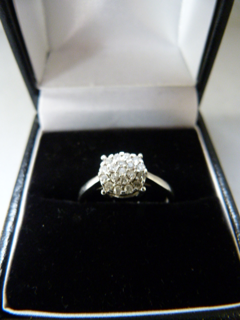 A Diamond cluster ring set in 9ct Gold - Size M 1/2