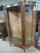 A bow fronted display cabinet