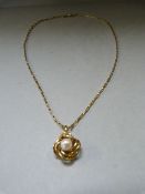 A 9ct gold pendant with pearl on 9ct gold chain