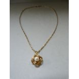 A 9ct gold pendant with pearl on 9ct gold chain