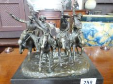 After Frederic Remington a bronze "Coming through the rye", modelled as four cowboys with guns