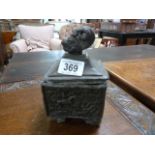 A lead tea caddy with dolphin finial