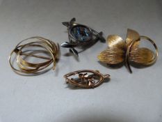 A 9ct Gold brooch, two others and a hallmaked silver brooch