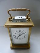 A brass carriage clock made by the mercantile watch Co.