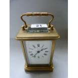 A brass carriage clock made by the mercantile watch Co.