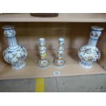 A pair of Delft onion vases and a pair of similar candlesticks