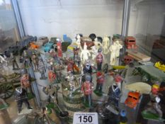 A quantity of lead toys and vintage toy cars