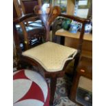 An Edwardian corner chair with inlaid floral decoration to back