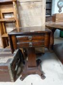 A Victorian drop leaf centre table with two drawers