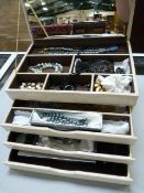 A quantity of costume jewellery in white case