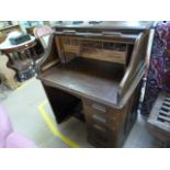 An oak roll top desk