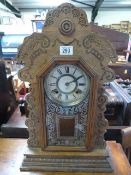 An Ansonia clock Co. American mantle clock- key and pendulum in office