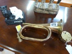 A brass and copper bugle, brass compass and a reproduction "Black & White" advertising dogs