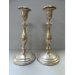 A pair of hallmarked ( Birmingham 1919) silver candlesticks- 1 A/F