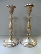 A pair of hallmarked ( Birmingham 1919) silver candlesticks- 1 A/F