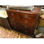 A stained pine chest of drawers