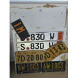 Seven license plates - four american ones from the 1930's