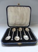 A cased set of hallmarked silver coffee spoons